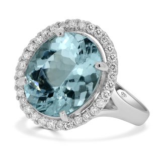 Oval aquamarine with round diamond halo ringOval Cut aquamarine engagement ring