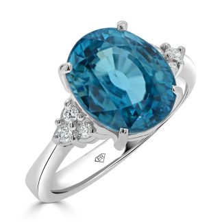 Oval London Blue and round diamondsTopaz and Diamond Dress Ring