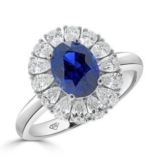 Oval sapphire and pear shaped diamond halo ringSapphire engagement ring with halo