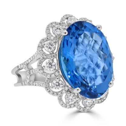 Oval Blue Topaz Diamond Dress Ring with a Halo and Flower Like Band