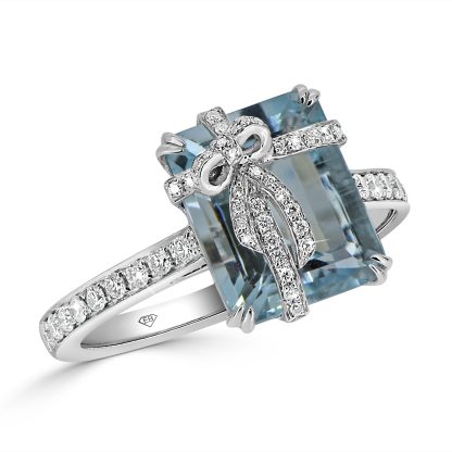 Aquamarine engagement ring with emerald-cut aquamarine and diamond bow