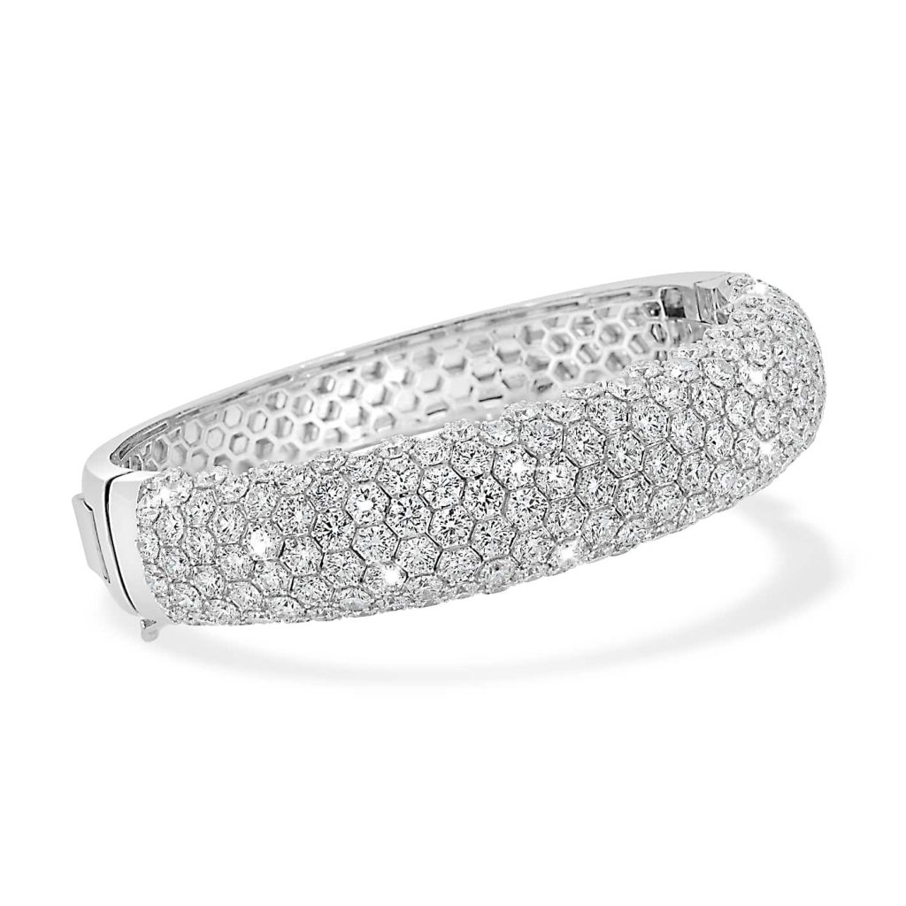 White gold diamond bangle featuring 160 diamonds totalling 17.63ct, crafted in an elegant honeycomb pave design with 18kt white gold.