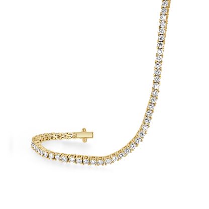 Gold tennis bracelet featuring 91 round brilliant diamonds in 18ct yellow gold.