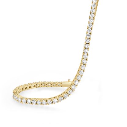 Gold tennis bracelet featuring natural round diamonds in 18ct yellow gold.