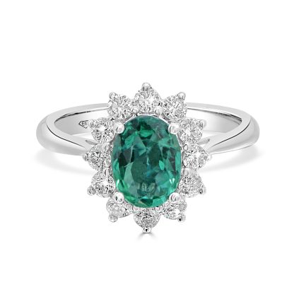 Emerald ring in 18kt white gold featuring a 1.13ct oval emerald surrounded by a diamond halo.