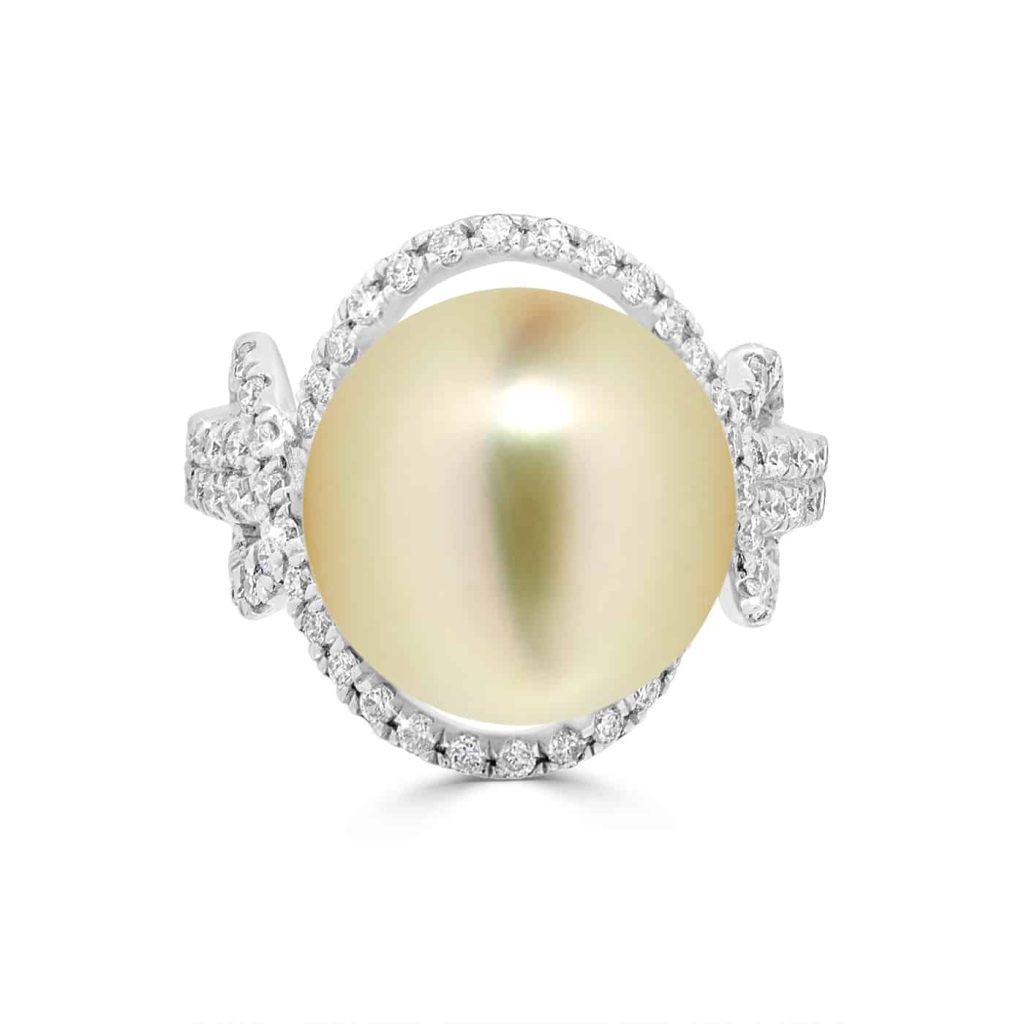 Golden pearl and diamond halo ring