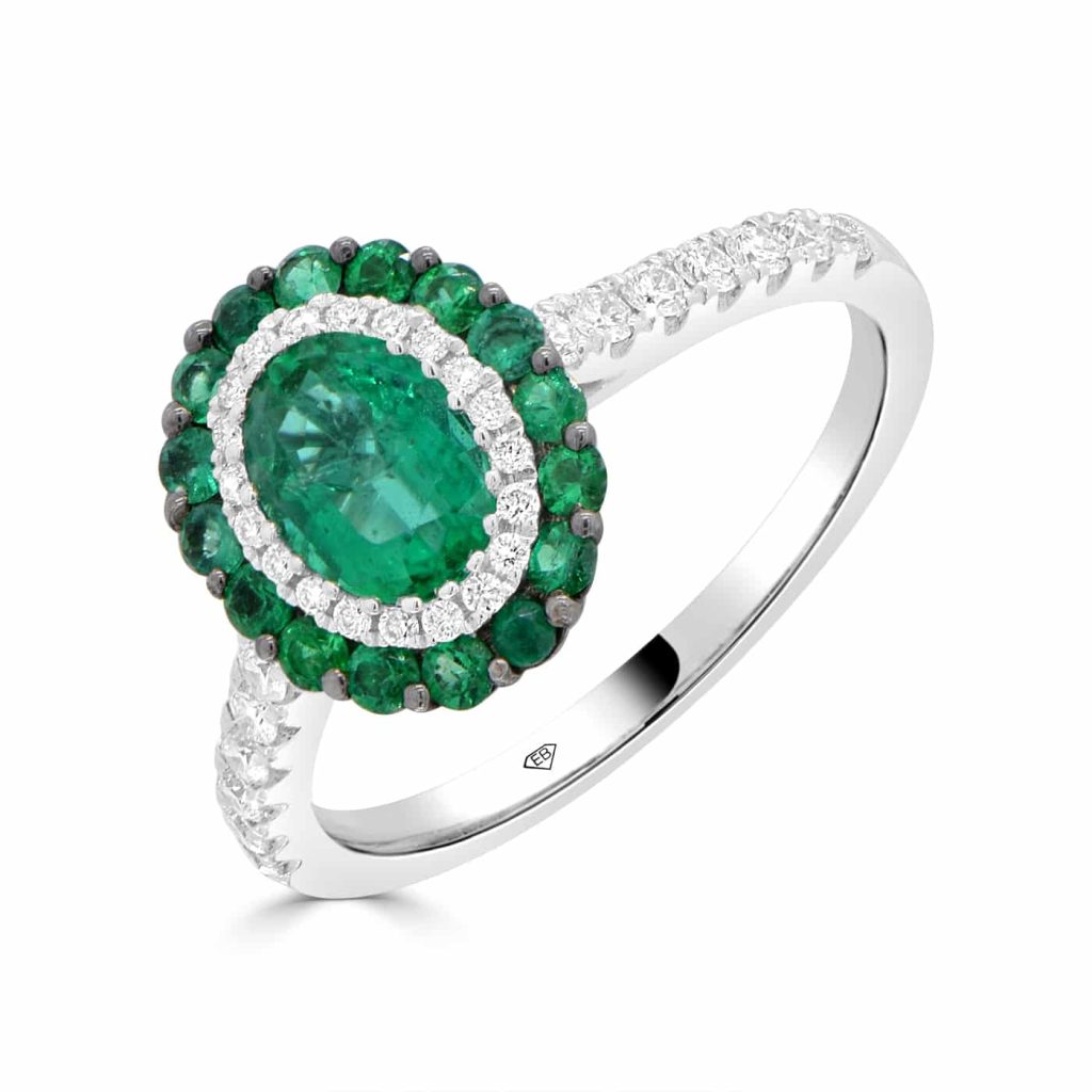 Emerald and diamond halo ring in white gold