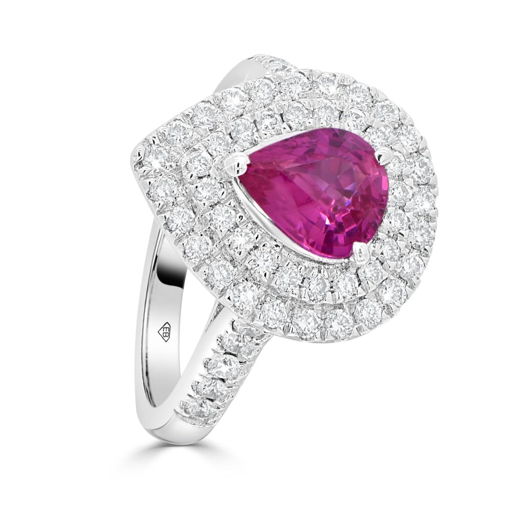 Ruby and diamond halo ring in white gold